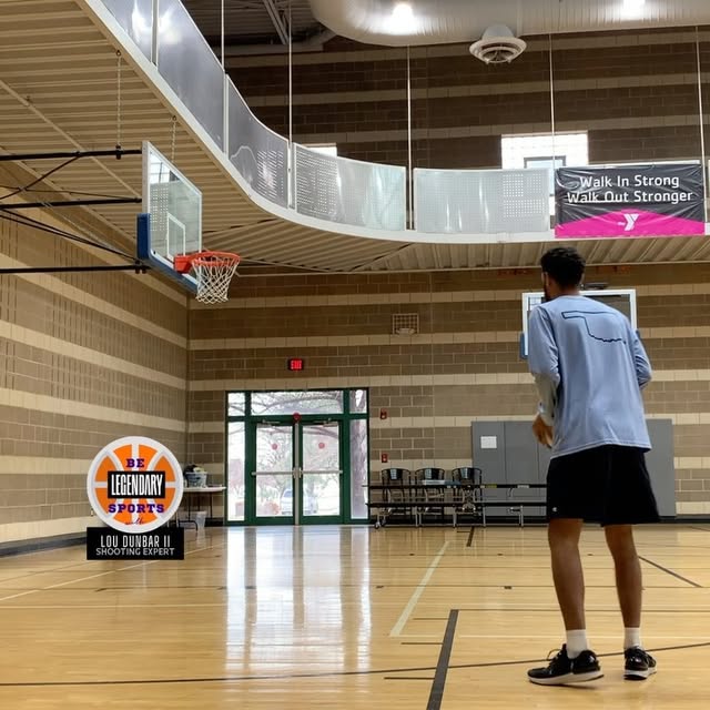 Lou Dunbar II shooting in a gym during a training session